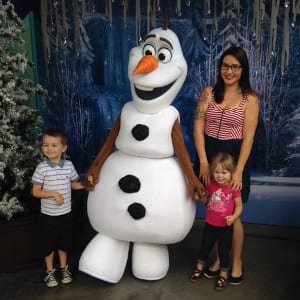 family with Disney snowman